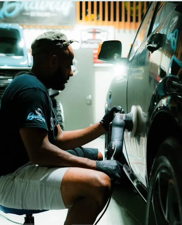 Ehudy Montas performing paint correction service at Supreme Bucks Detailing Sugar Hill GA